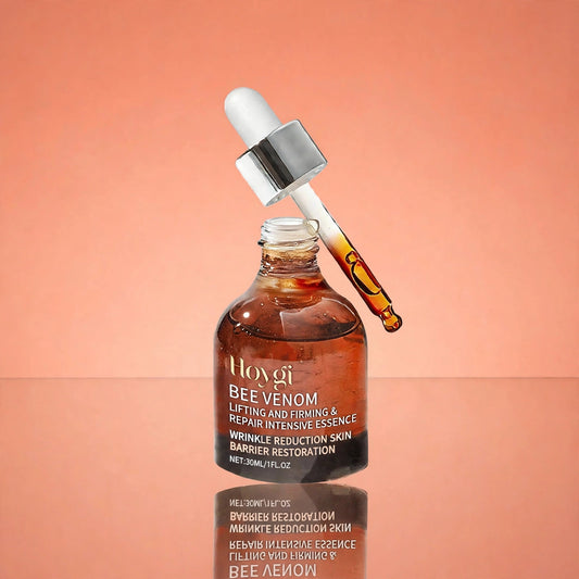 Bee Venom Lifting and Firming Essence on peach background